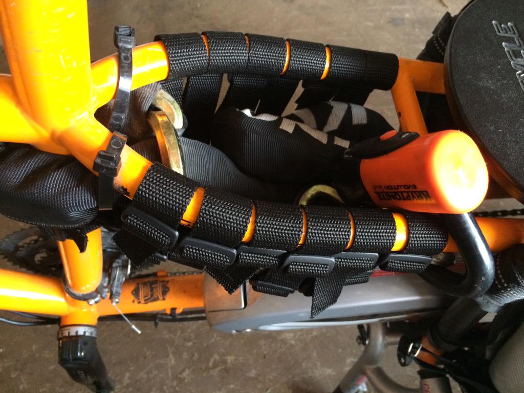 CampfireCycling's tweet photo. Rigging up a holster for my massive chain lock on my @xtracycle. Going for the fastest lockup in the West #joybag http://t.co/TCDXFHNL28