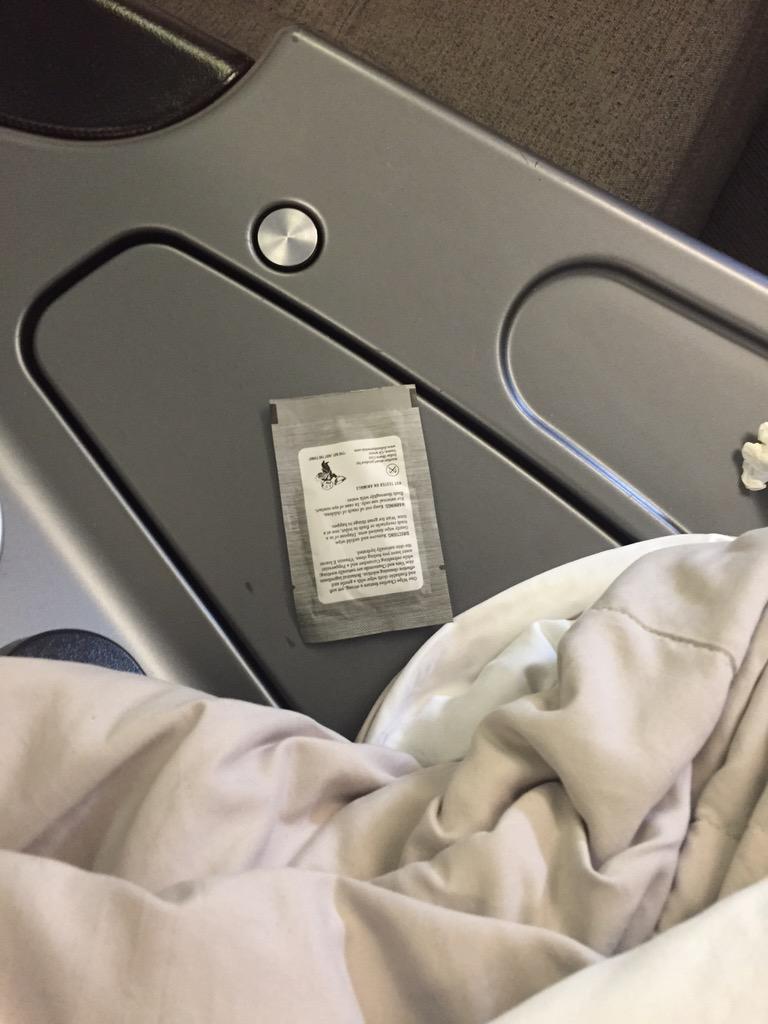 speakman's tweet image. First in a photo series of (unused) #onewipecharlies in the wild: United 493, seat 1C, O'Hare cc @DollarShaveClub