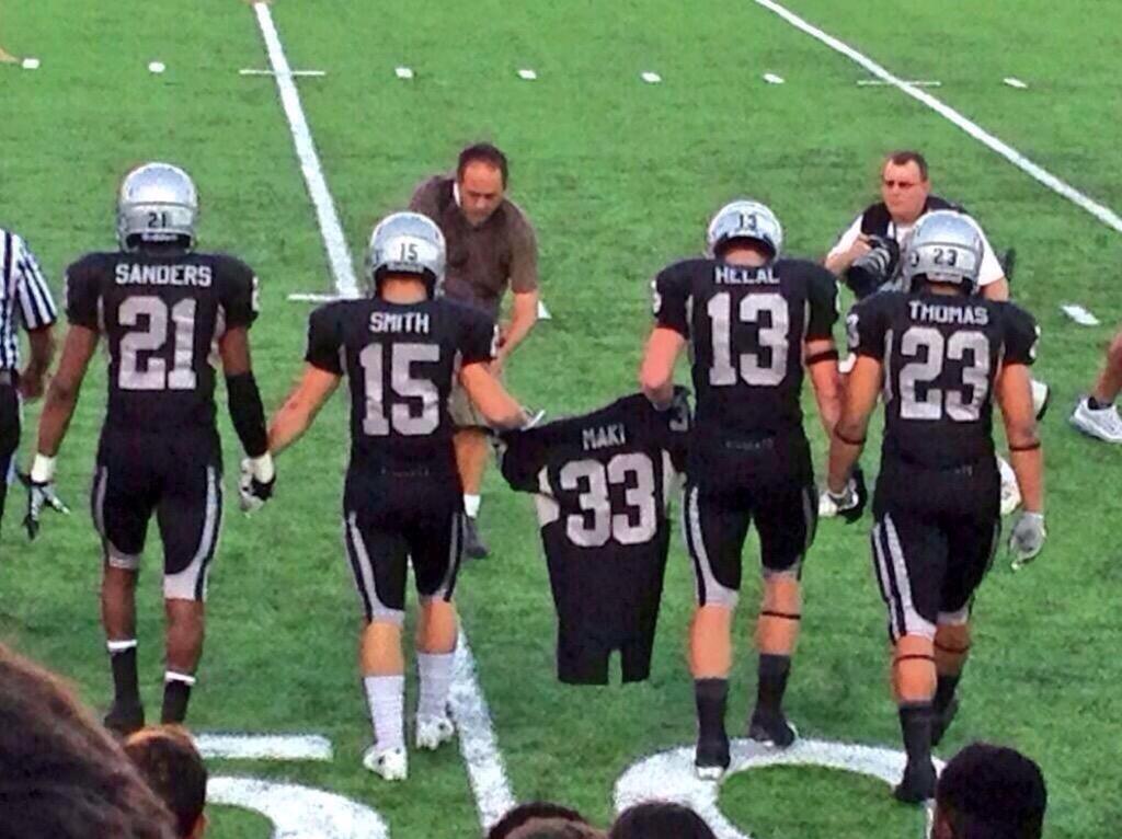 BsbPorn's tweet photo. Guyer HS football players carry the jersey of their lost teammate onto the field. This deserves endless retweets... http://t.co/H8NjTTzA7W