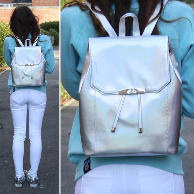 Primark's tweet photo. Stand out in the crowd like @xxGeorgina18 with this holographic back pack! £10/€12 #Primark #primarkspring15 http://t.co/CXJx9GLQwM