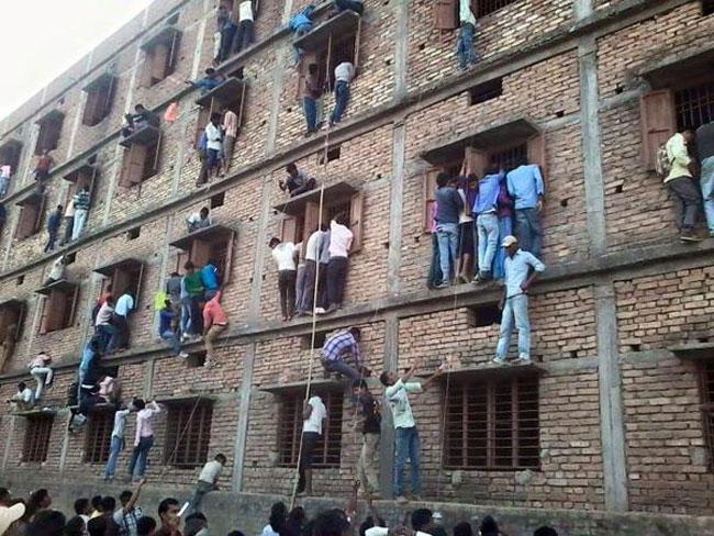 This photo shows parents scaling a multi-story building to help their kids  cheat on an exam - Vox