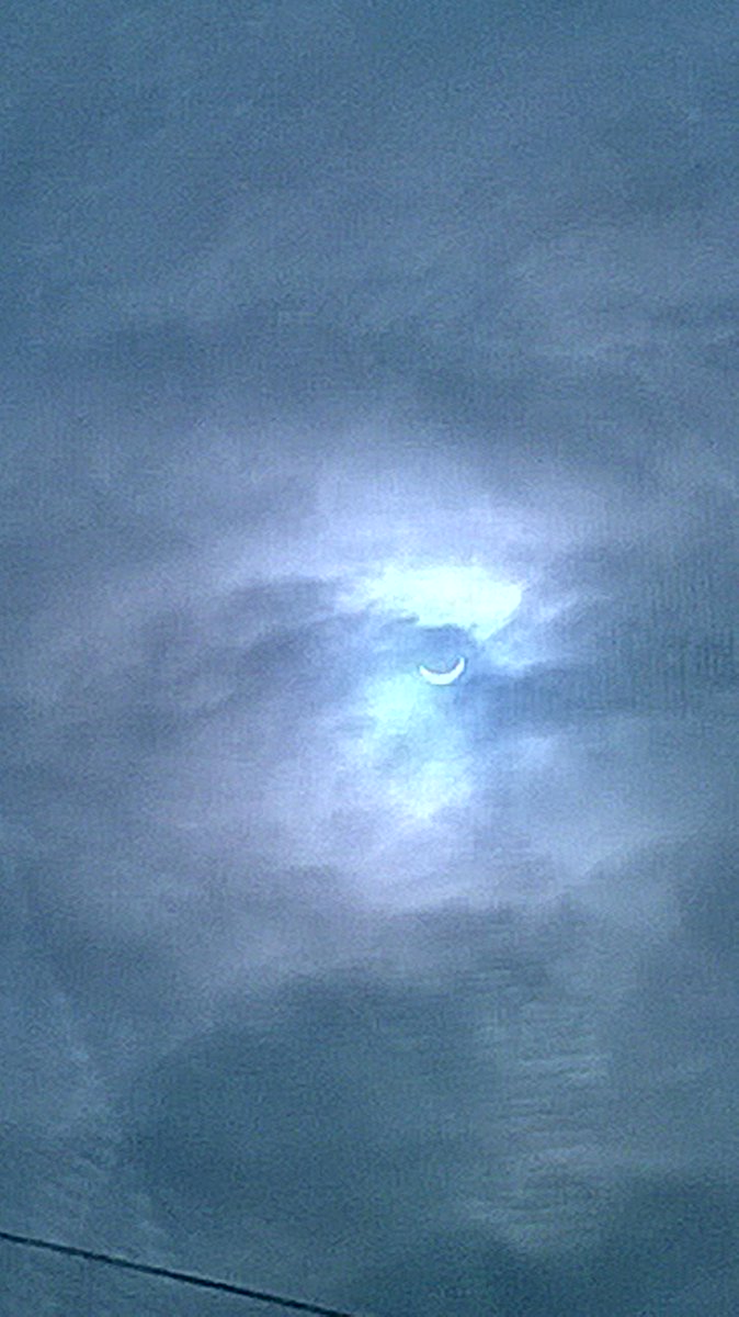 SherpaMind's tweet photo. Not the best using a window reflection but I got a pic anyway #myfirsteclipse #PartialEclipse http://t.co/WlXWijbeIj