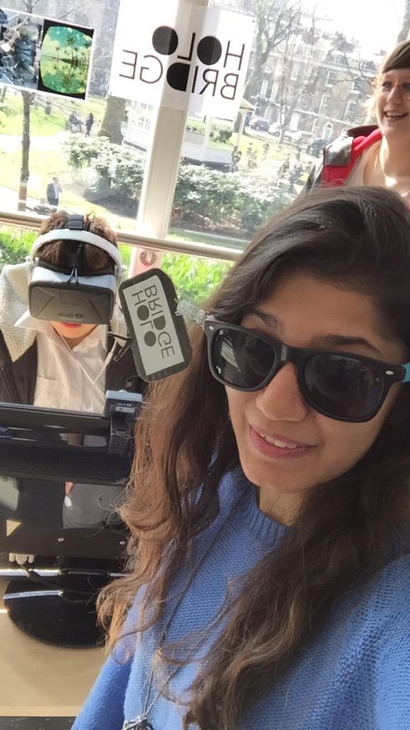 HoloBridge's tweet photo. #photobombing people trying the #OculusRift  . Do not miss your chance! Come visit us. We are here till 3 today! http://t.co/BsJNkEkacQ