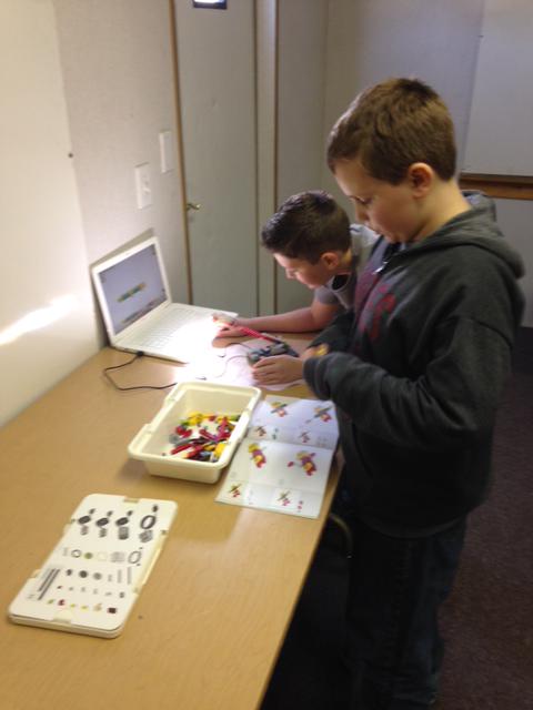Students collaborating together on a WeDo Lego build.