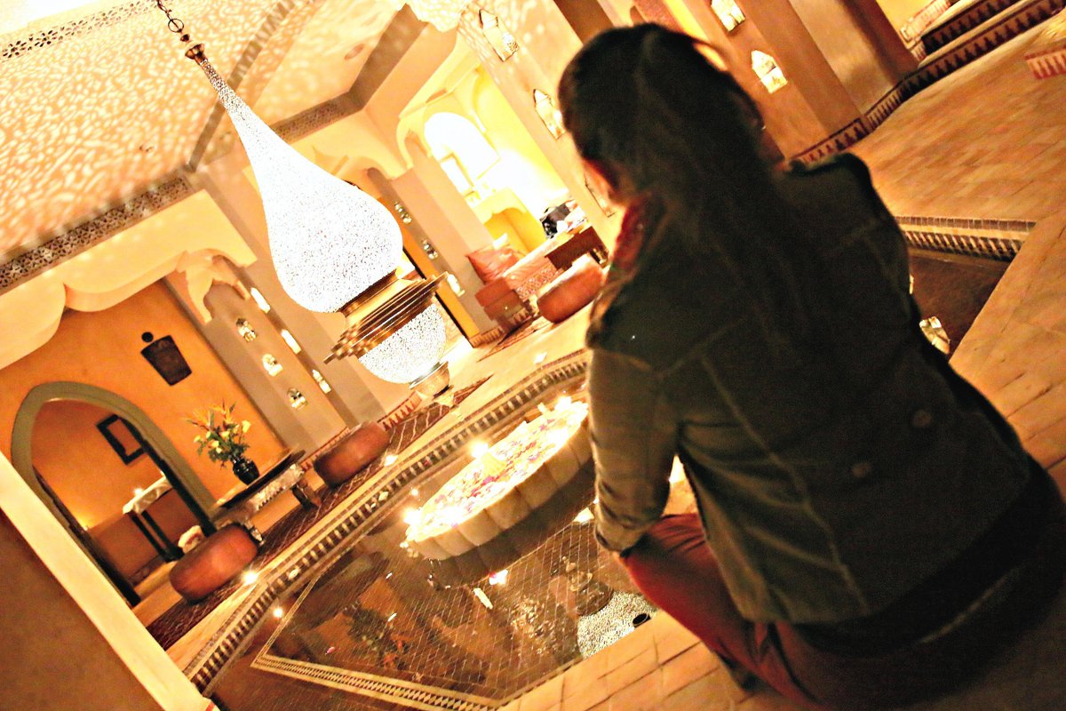 A tourist mesmerized by a #Moroccan #Lighting #Masterpiece. Working on a couple of these beauties for a US client.