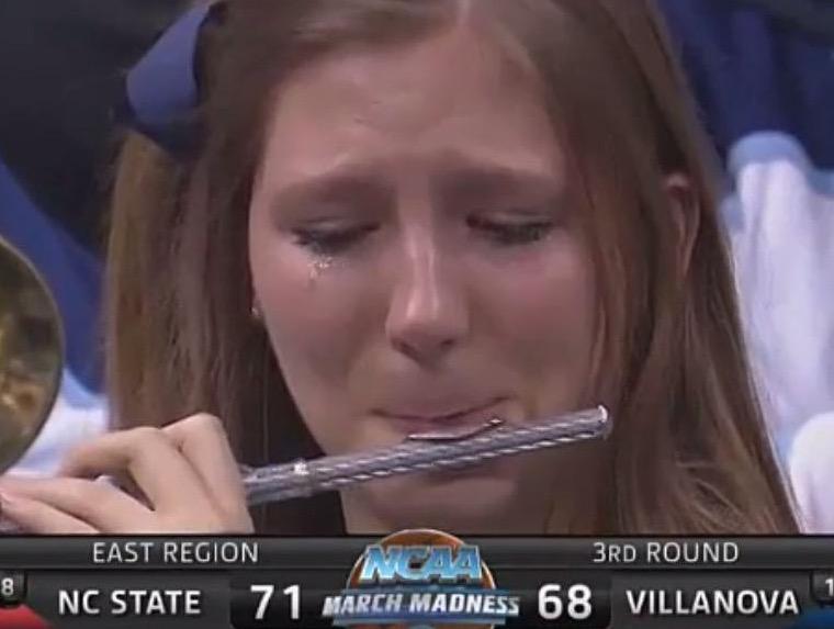 BleacherReport's tweet photo. VIDEO: Crying Villanova piccolo player fought back tears while playing after loss vs. NC State http://t.co/cVPyDAUqp8 http://t.co/RFK5n9S2WM