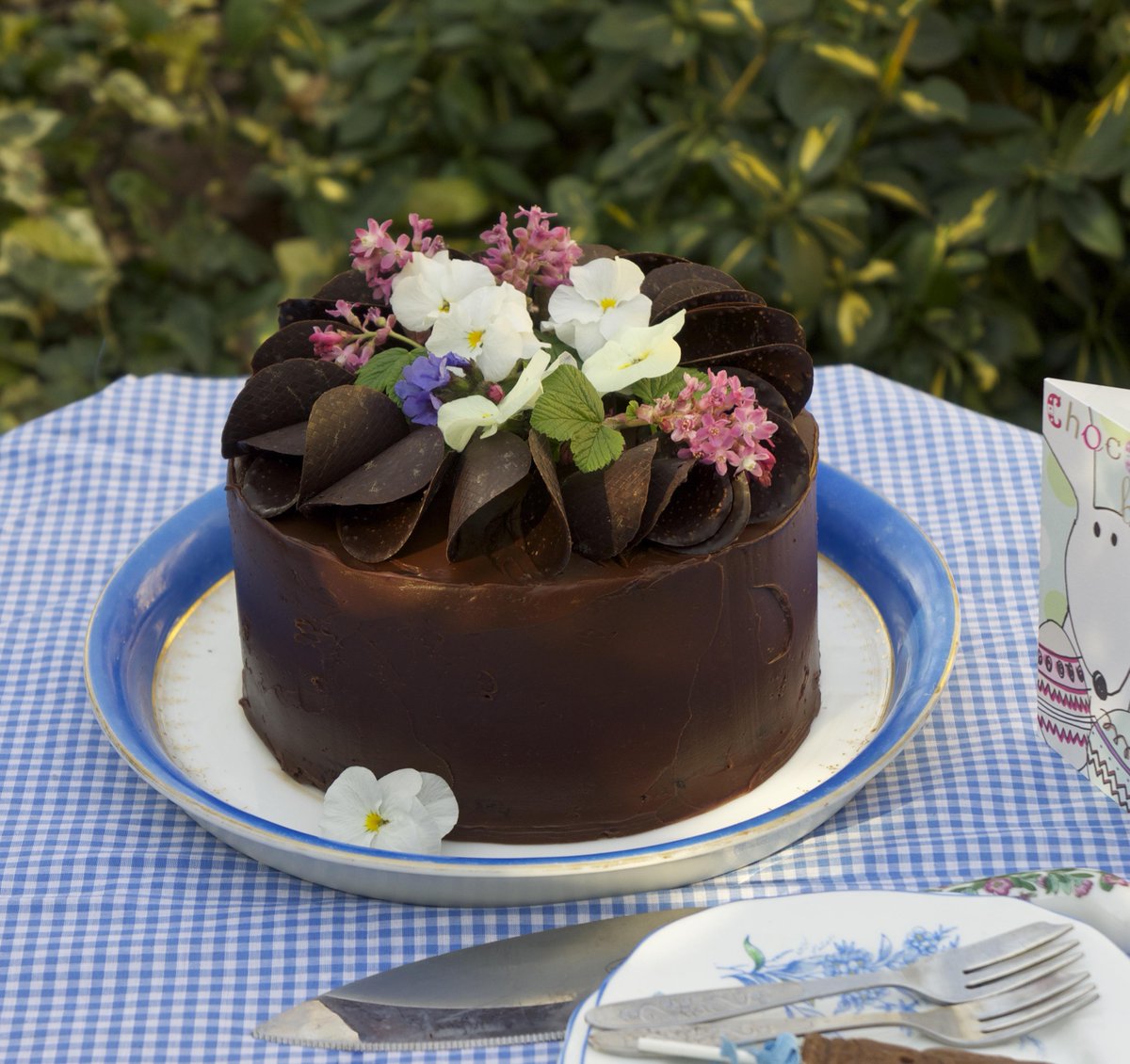 My take on <a href="/deliciousmag/">delicious. magazine</a> rose petal chocolate #cake. No roses yet in my garden so used Spring blooms. So pretty!
