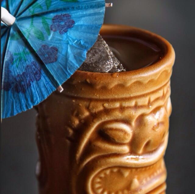 An umbrella is absolutely required on beach days. #sandiegospring #tiki #cocktails #thrusterslounge #pacificbeach