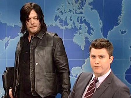 people's tweet photo. WATCH: Norman Reedus (and his crossbow) crash SNL's Weekend Update http://t.co/42MqGl9I77 http://t.co/0uyhYKPCoy