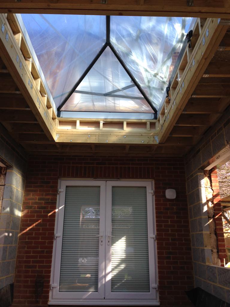 Single storey dinning room extension with bespoke frameless roof lantern