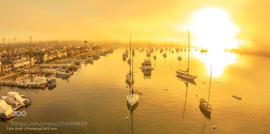 balboaharbor by kiwicolin ... Sunrise at Balboa harbor in California. A lone drone passes over the water and I capt…