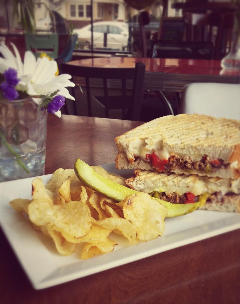 Southwest Panini~Chorizo, White Cheddar, Jowl Bacon-Black Bean Spread, Roasted Red Peppers, and Jalapeños. Mmmm