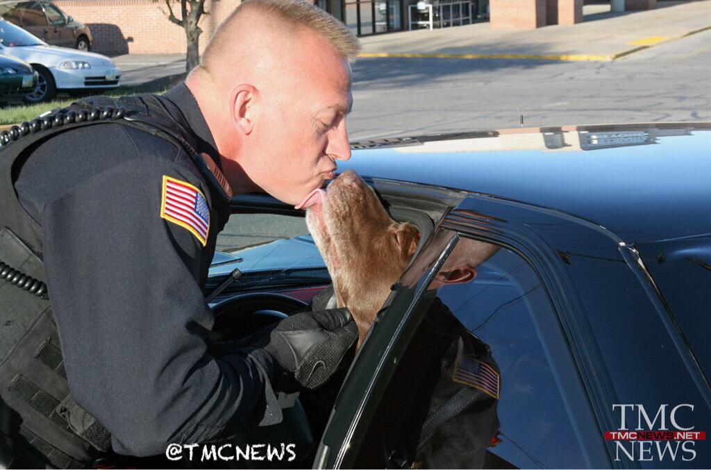TMCNEWS's tweet photo. #TBT @ElyriaPolice Officer Jim Rider gets a special thank you at a crash scene. #Cops #puppy #Kiss #Dogs #K9 #The253 http://t.co/59peP1Orid