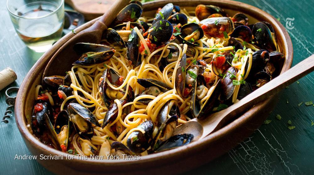 nytimes's tweet photo. Pasta with mussels is one of those complex-tasting dishes that is simple to make http://t.co/bgaqsHhREN http://t.co/YsC3SIqSiF