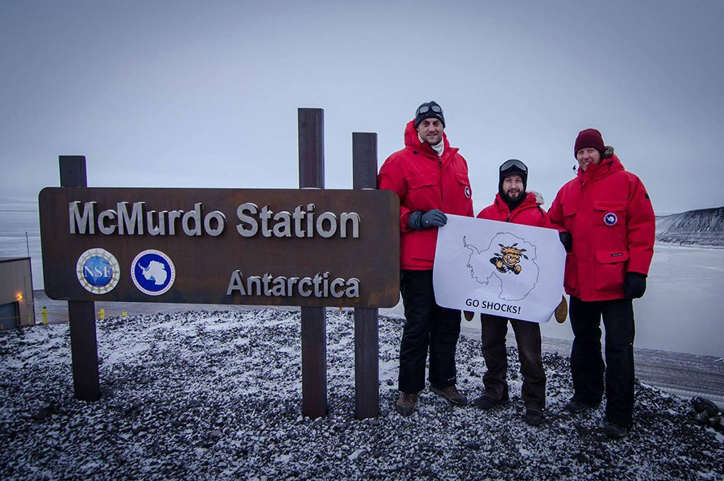 WichitaState's tweet image. Fans and alumni are cheering on the Shockers from far and wide, including these three from Antarctica!