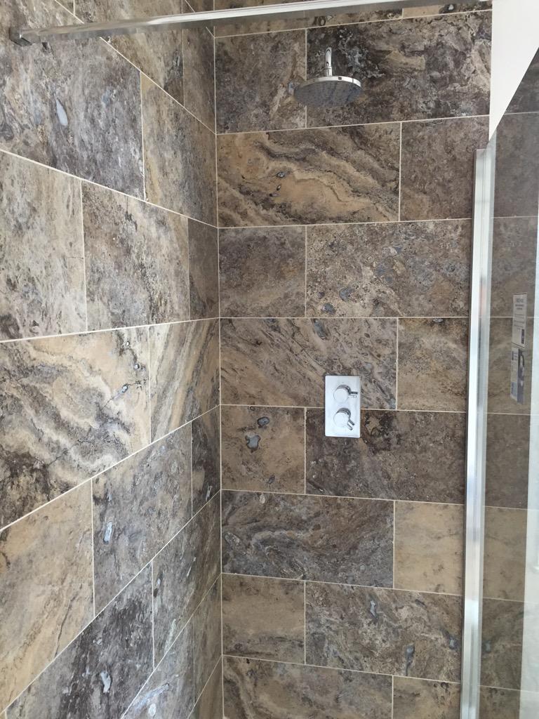 GHBuilding's tweet photo. Travertine tiles in a shower enclosure http://t.co/0nGtNc37dK