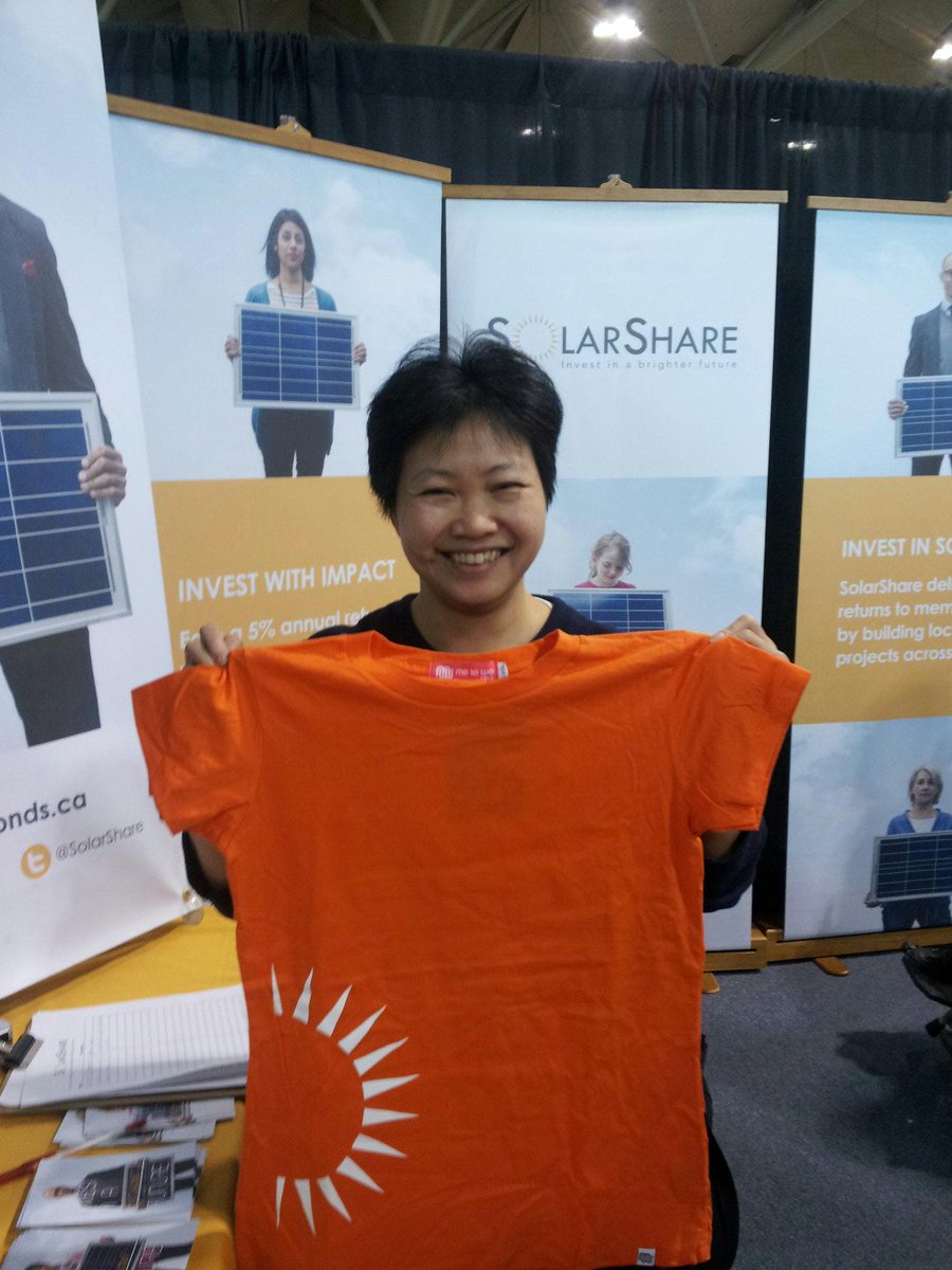 SolarShare's tweet photo. Congrats to new member-investor May who just bought a #solarbond at #GLS2015 ! http://t.co/h7uEcYf9WS
