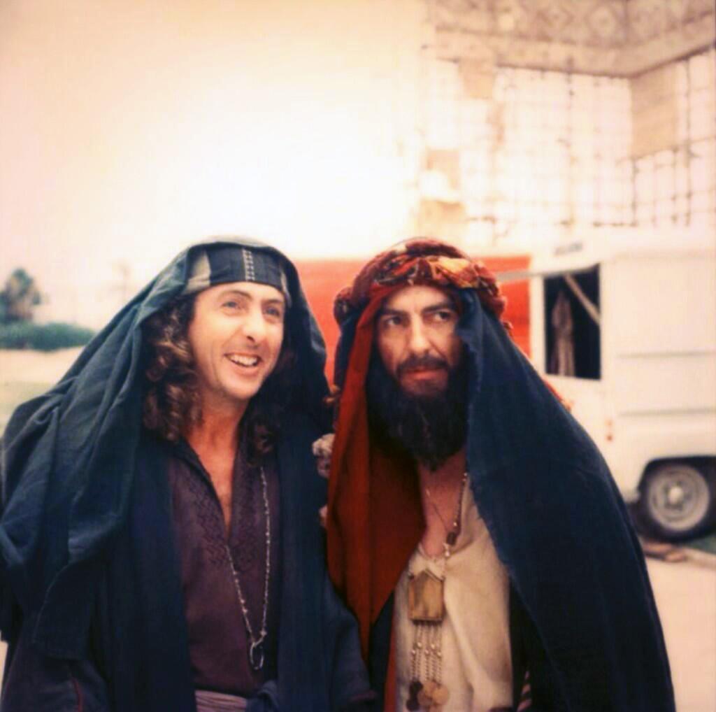   Eric Idle and George Harrison on the set of Life Of Brian.  happy Birthday 