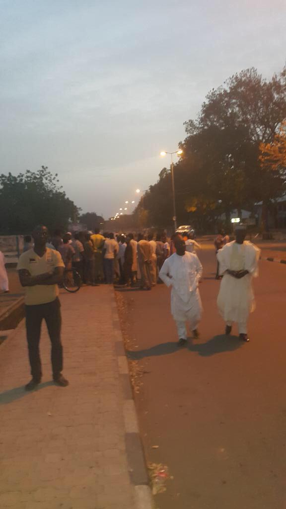 Bauchi_Facts's tweet photo. Despite The Curfew In The State People Are At The INEC Office Some Were Even Praying The Magrib Prayers There http://t.co/e2jwYSYe83