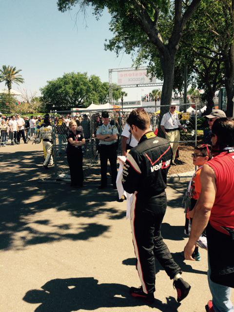 KRSDunn's tweet photo. Will Power stops to sign autographs on his way to the track. @breezygarden45 @RocketSportsEnt @boburna #PaddockView http://t.co/n9JqSMX1Gz