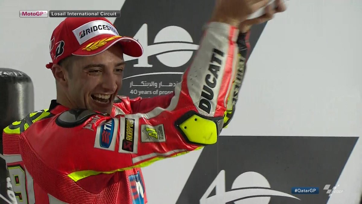 MotoGP's tweet photo. First podium for @andreaiannone29 in #MotoGP. Congrats Andrea! #QatarGP @DucatiMotor http://t.co/n3el7ylI2f