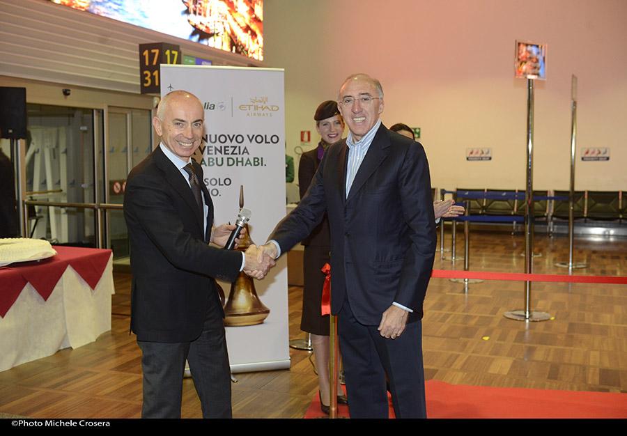 Alitalia's tweet photo. Cassano #AlitaliaCEO and Marchi #SAVEChairman ribbon cutting ceremony at VCE for the new flight @AUH @EtihadAirways http://t.co/YGyq8rYob5