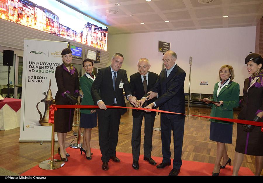 Alitalia's tweet photo. Cassano #AlitaliaCEO and Marchi #SAVEChairman ribbon cutting ceremony at VCE for the new flight @AUH @EtihadAirways http://t.co/YGyq8rYob5