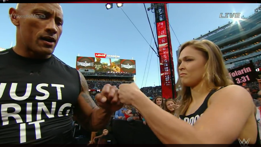 TheRock's tweet photo. Yes, but not the world;). RT: @FanSided: Rock &amp; @RondaRousey form team that can destroy world. http://t.co/Qtg5nt9sHw http://t.co/eOLtq5vL5J