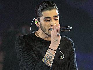 people's tweet photo. Listen: Is this Zayn Malik's first new song after leaving One Direction? http://t.co/9fYYeINIBf http://t.co/qdKWbgDfWh