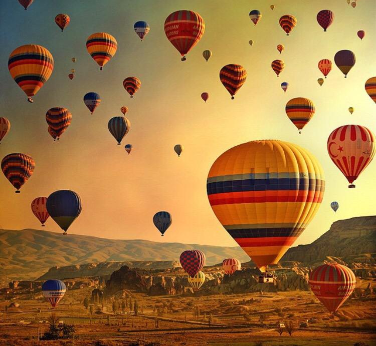 GoAdventure_com's tweet photo. Ballooning over Cappadocia #Turkey enjoying a breathtaking sun rise @Turkey_Home http://t.co/9tWNucn5Vb