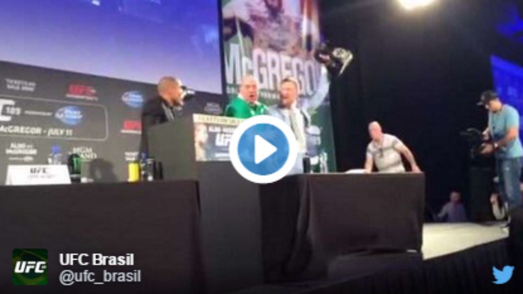 mmamania's tweet photo. .@TheNotoriousMMA snatches @josealdojunior belt, all hell breaks loose in Dublin #UFC #MMA http://t.co/Ux2iOvx8LB http://t.co/YBdxCRIUMX