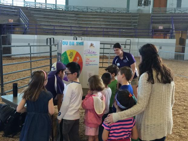 KSUPreVet's tweet photo. Officers are working with first graders teaching about animal agriculture as a part of @kstateag #AgWeek2015 http://t.co/Zs7WLRS4Zw