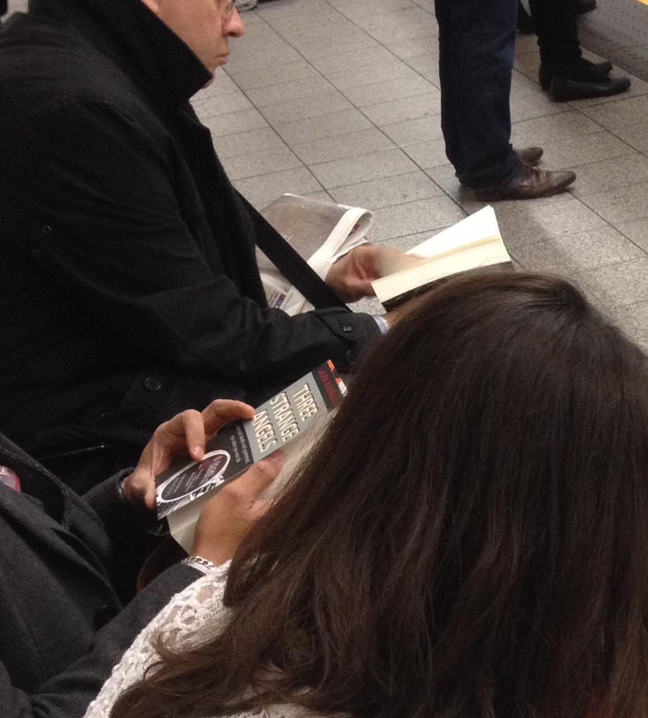 BooksUndergrnd's tweet photo. Great to see people grabbing #ThreeStrangeAngels along the platform today - tweet if you found one! http://t.co/5AB1Mtr2Ly