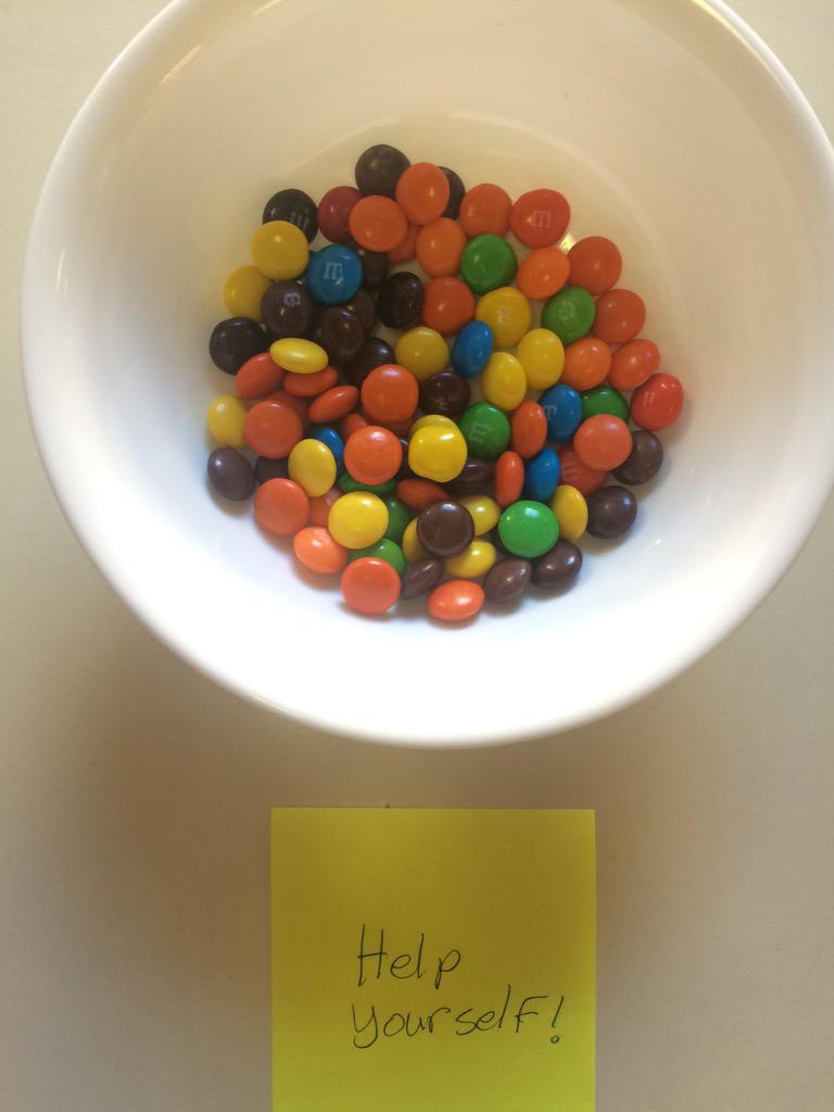 Skittles mixed with M&amp;Ms. Some sicko's idea of an office April Fool's Day prank. #NotAmused