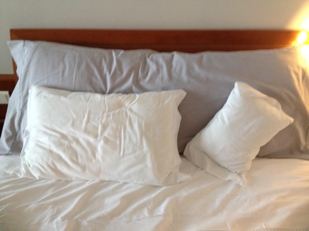 Daddy, mummy and baby pillow in hotel room!