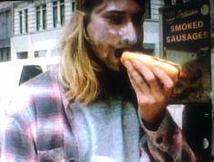 ppleating's tweet image. Kurt Cobain eating a hotdog in the Heart Shaped Box video.