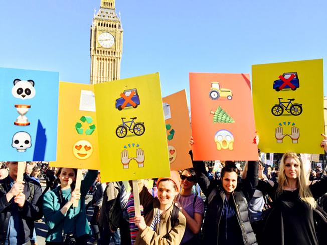 digitalmediaix's tweet photo. Emojis are being used everywhere...they're even printed on posters at an environmental rally! http://t.co/BulP7GFfgH http://t.co/lpOGZWVtXb