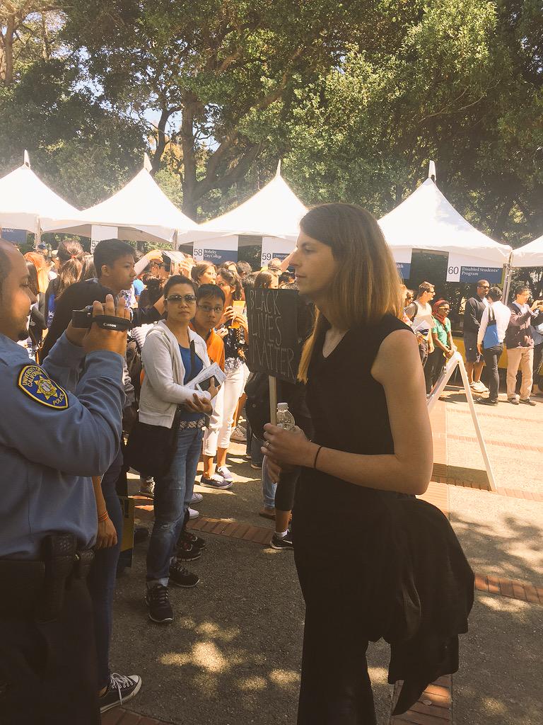 Abbas_Muntaqim's tweet photo. This is what being an ally looks like. This lady blocked the cops from filming us. #BlackAtCalDay #Ferguson2Cal http://t.co/UouiPd7pJ8