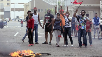 cnni's tweet photo. What is behind the xenophobic attacks that are plaguing South Africa? http://t.co/L8qL1CUbtR http://t.co/evF4eVdQPE