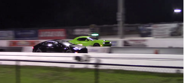 Jalopnik's tweet photo. Hellcat takes down Tesla in rematch drag race, muscle car guys rejoice. http://t.co/1EJw3YeCQ8 http://t.co/YIPyDt3eAt