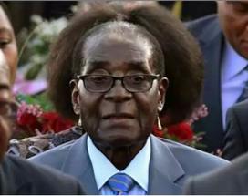 mmmmmalusim's tweet photo. #Mugabe new hairdo and earings. Lmao damn http://t.co/sHGDHE77YL