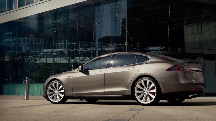 latimes's tweet photo. Today @TeslaMotors will roll out a new all-electric car for less than $70k, after incentives http://t.co/FJ5trhd5al http://t.co/JZXq3kzxuj