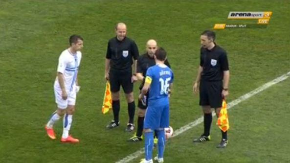 Ademi chats with the referees