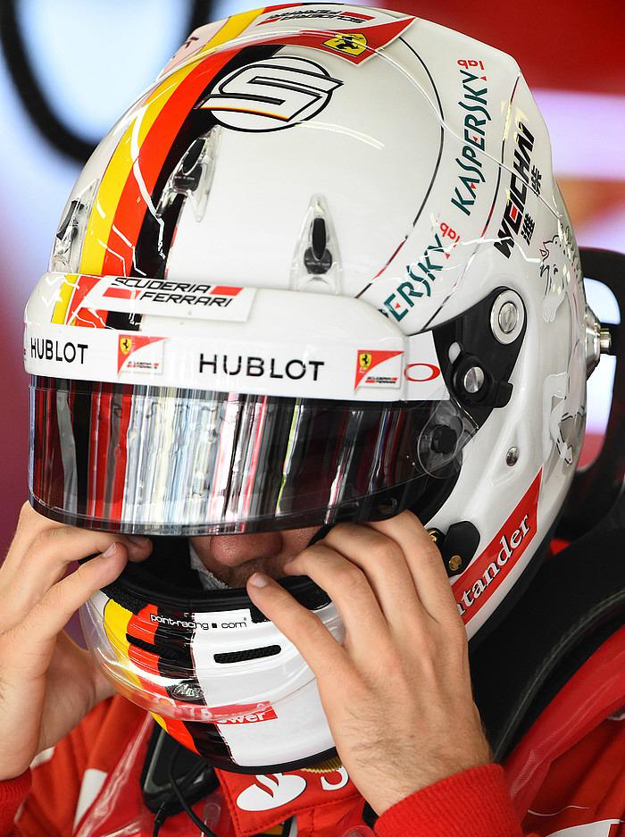 sebvettelnews's tweet photo. Close up shots of Sebastian Vettel adjusting his helmet in the Ferrari garage during FP1. #ChineseGP #F1 #Seb5 http://t.co/EJ2LkdCUFU