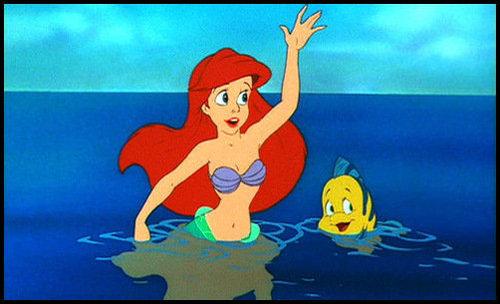 After Ariel roamed around the sand with her new legs she emerged onto the new land and waved as the person came bye--