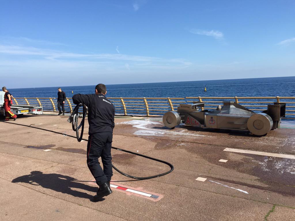 Monaco's fire fighters practicing on an #F1 model car. Let's hope they won't need the practice. #monaco