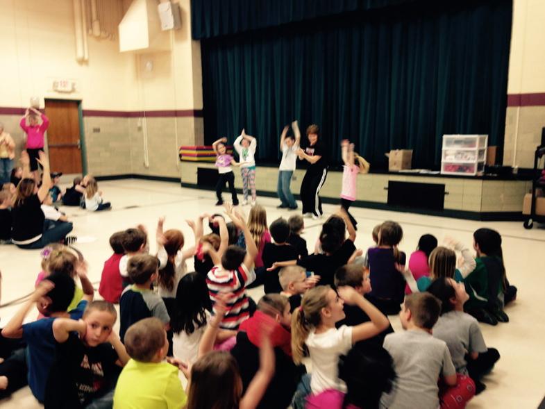 PBIS assembly. Celebrating with a little YMCA. Respectful, Responsible, and Safe.
