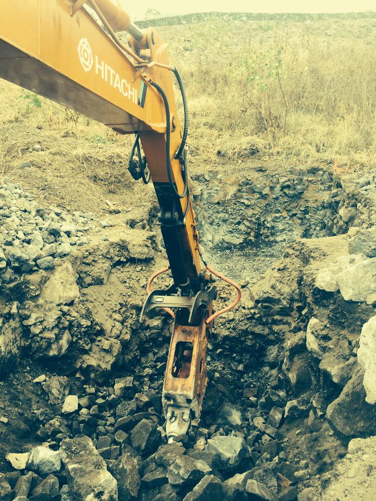 TylerBuildingHI's tweet photo. Typical excavation for a septic system in Hawaii. All rock!  Just need the right equipment. http://t.co/PupQf5QJ91