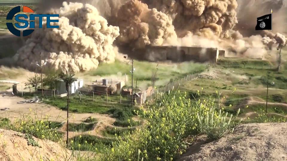 siteintelgroup's tweet photo. #ISIS released a video of fighters smashing and blowing up archaeological sites in the ancient city of Nimrud. http://t.co/TOPBbKgMT5