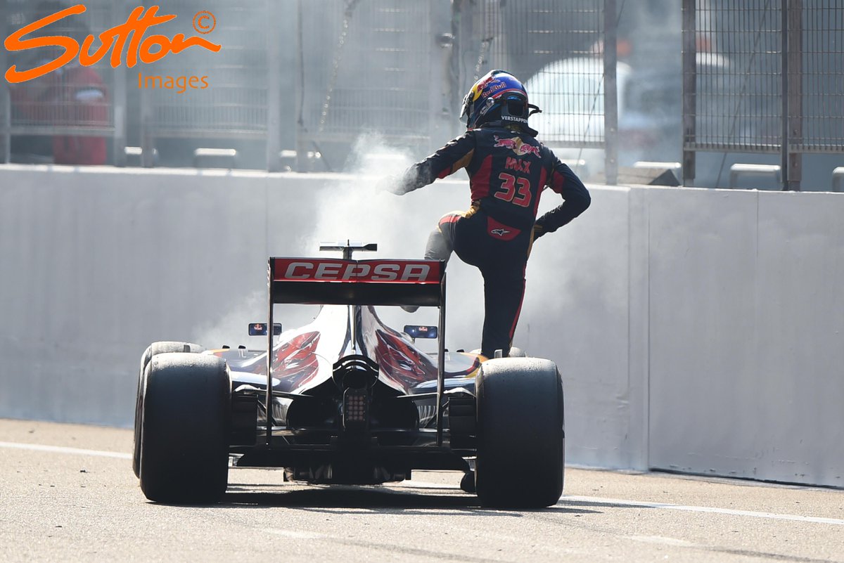 MSI_Images's tweet photo. Drama - @MaxVerstappen3 climbs out of his smoking @ToroRossoSpy on the pit straight #ChineseGP #F1 http://t.co/UdRwbQTNKa